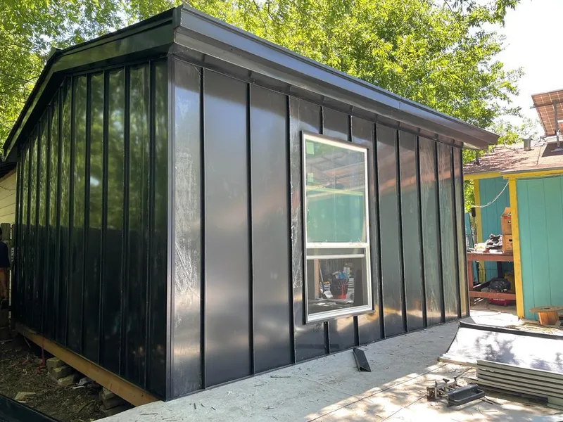 Black standing seam metal wall panels for Metal Roof Installation in Thompson