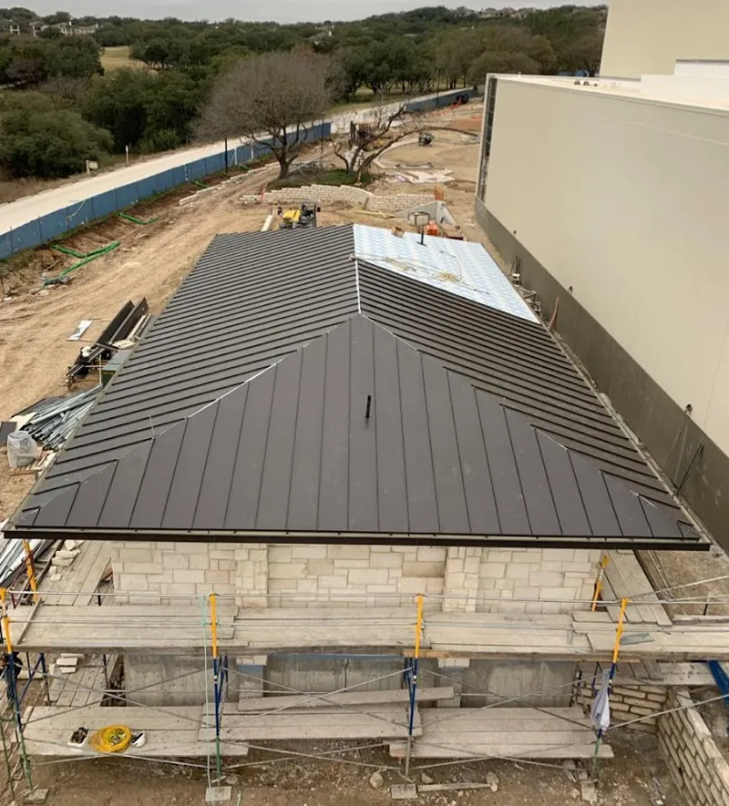 Metal roof new construction with scaffolding in Thompson